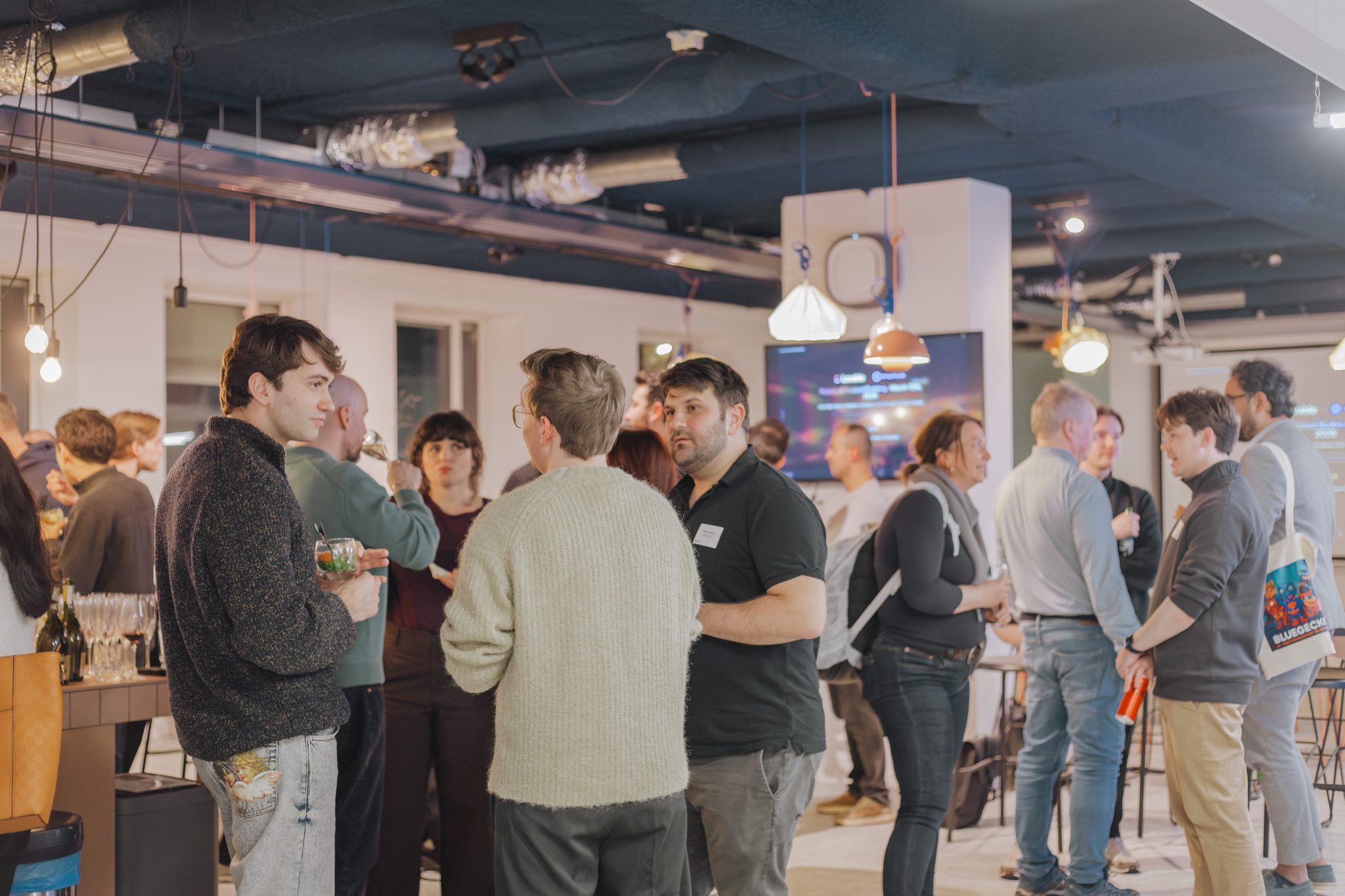 Attendees talking together during the networking portion of the Amplitude community event in Amsterdam.